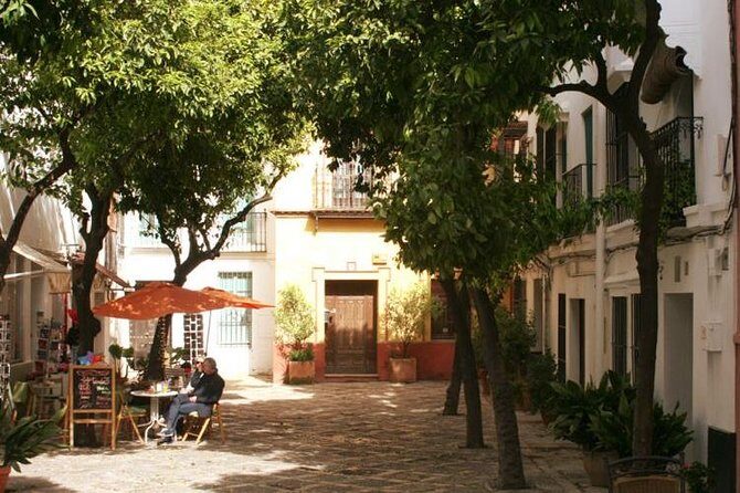 Alcázar and Jewish Quarter Guided Walking Tour in Seville - Short stops that add context: Venerables and Archivo General de Indias