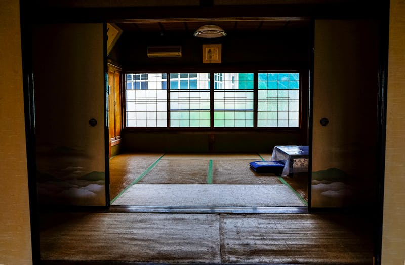 Traditional Japanese ryokan room with tatami and sliding doors