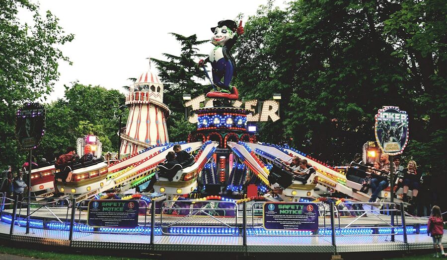 Families enjoying rides at a theme park